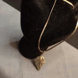 Gold-toned necklace with gold leaf feathered with cz chips